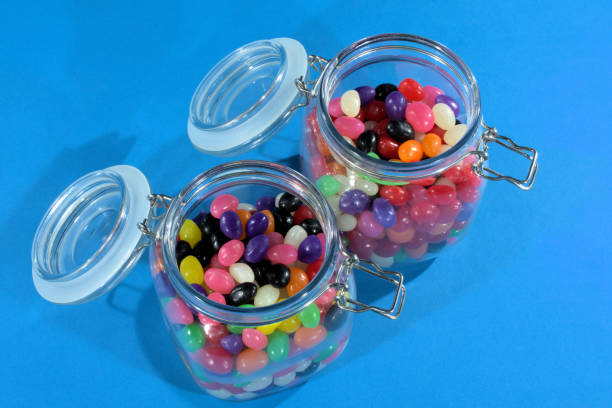 istock Two open jars of jellybeans 1206078815