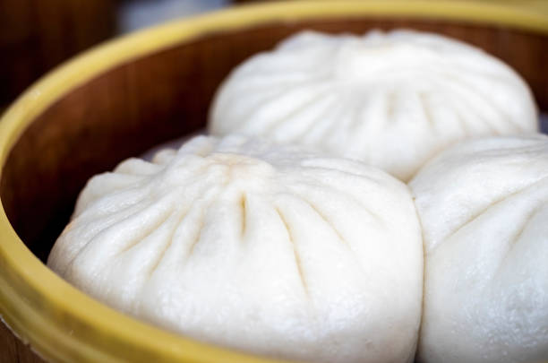 istock Freshly cooked Chinese Baozi or buns in bamboo steamers 1206081767