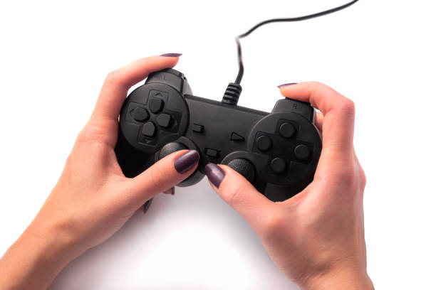 istock Black gamepad in female hands 1206084052