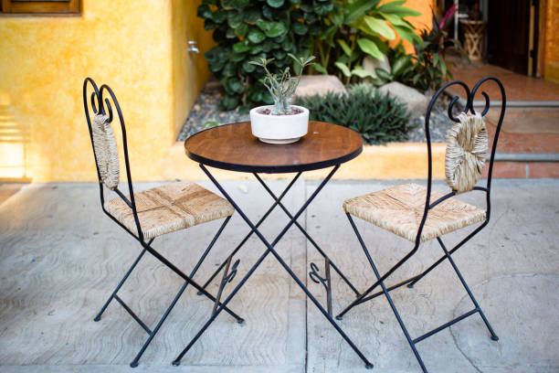 istock Small table with tow chairs an potted plant 1206085447