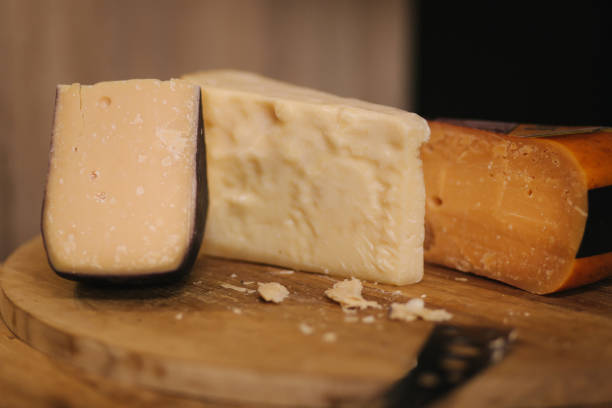 istock Different types of aged cheese on wooden board 1206085723