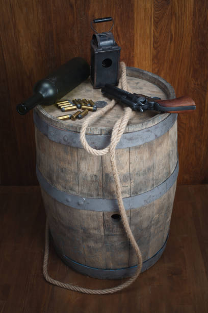 istock Old western revolver with cartridges and silver dollar 1206086441