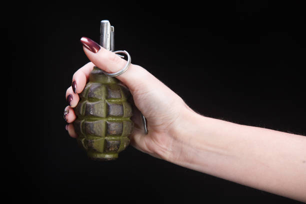 istock fragmentation grenade in girl hand 1206086716