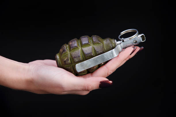 istock fragmentation grenade in girl hand 1206086724