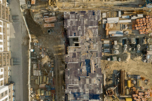 istock Construction and construction of high-rise buildings, the construction industry with working equipment and workers. View from above, from above. Background and texture 1206086881