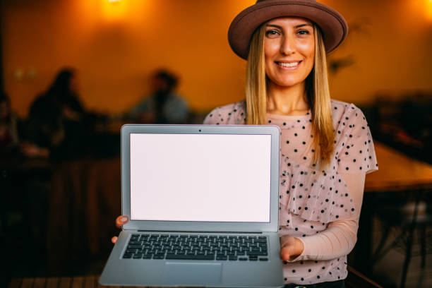 istock Young Woman Showing Laptop Screen 1206091511