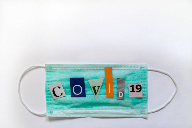 Surgical face mask with COVID-19 inscription