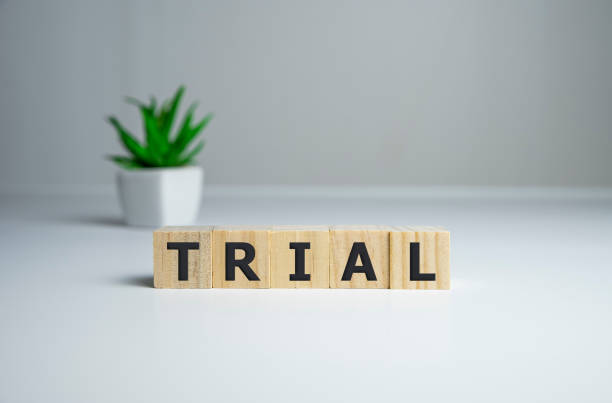 istock trial, word cube on wood background, business concept. 1206098424