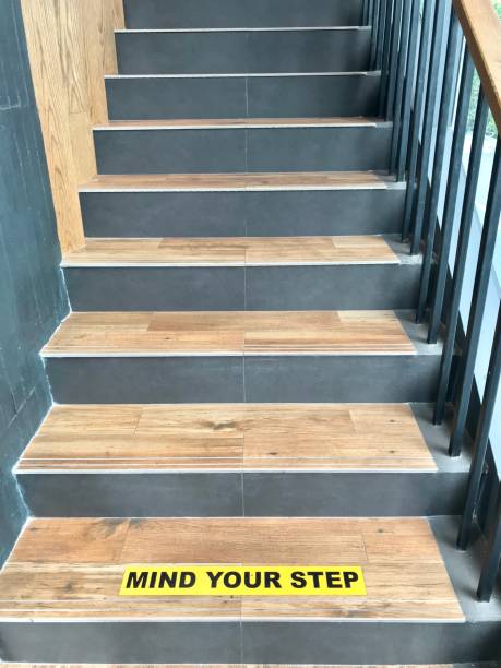 istock Wood Stair with Mind Your Step Sign 1206101355