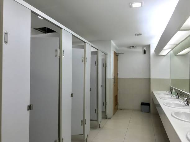 Row of public toilet decorated with wooden partition stock photo