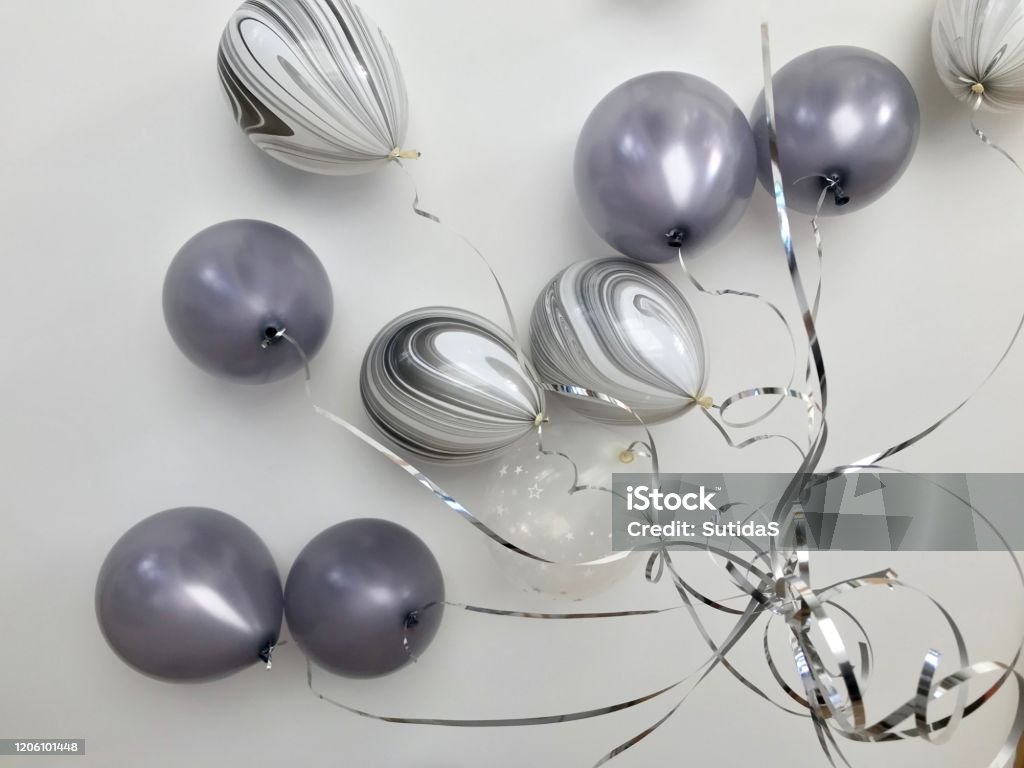 Gray colored balloon for decoration in the party Group of birthday balloons floating to the ceiling Gray Color Stock Photo