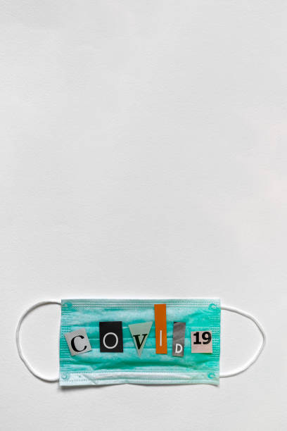 istock Protective medical mask with COVID-19 text 1206104530