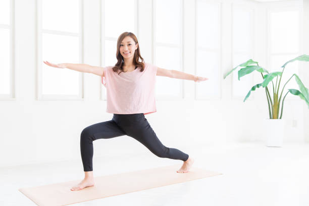 istock asian woman exercising in the room 1206111994
