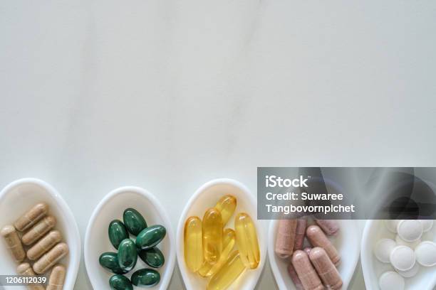 Top View Of Natural Vitamin Supplement On White Spoon As Frame Of Marble Texture Background Healthy Eating Lifestyle Trend Concept Stock Photo - Download Image Now