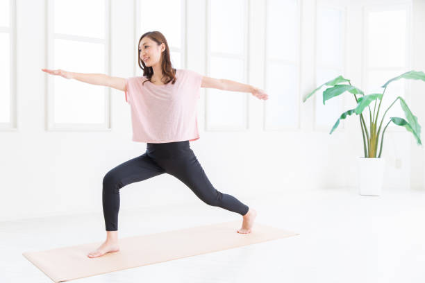 istock asian woman exercising in the room 1206112086