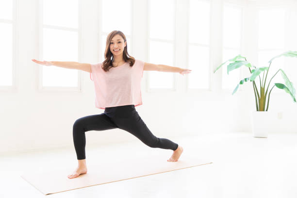 istock asian woman exercising in the room 1206112121