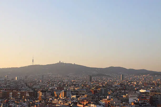 A skyline of Barcelona with a view of Tibidabo mountain.