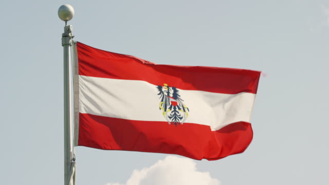 Slow Motion Shot of the Flag of Austria Blowing in the Wind on a Sunny Day