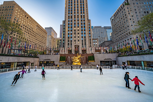 People ice skating at the Rockefeller Center, a famous tourist destination in Midtown Manhattan on October 15, 2019 in New York