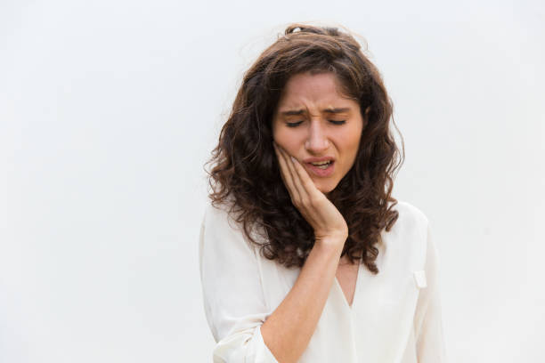 istock Upset young woman with toothache. 1206136217