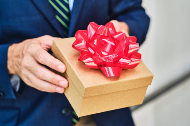 istock Male hands holding a gift box 1206138778