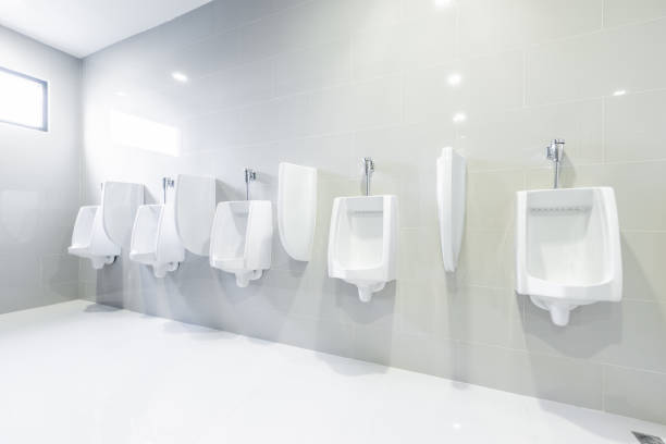 public toilet urinals lined up, no privacy. - urinal clean contemporary in a row imagens e fotografias de stock