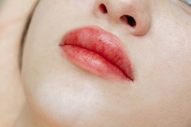 Women's face. Perfect skin with freckles, soft make-up. Young beautiful woman.