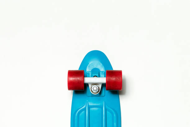 istock Skateboard cruiser with blue deck and red wheels on isolated white background, top view with copy-space. Concept of sport lifestyle, culture, leisure, hobby, alternative transport 1206146564