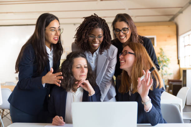istock Front view of cheerful businesswomen talking during work 1206150100