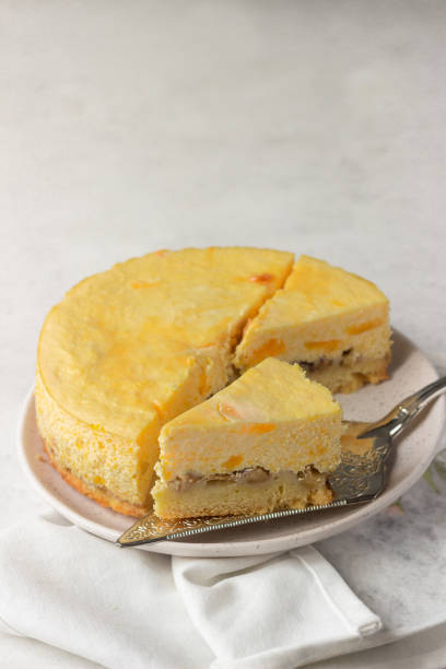istock Pumpkin cheesecake with caramel sauce, light grey stone background. Selective focus. 1206150167