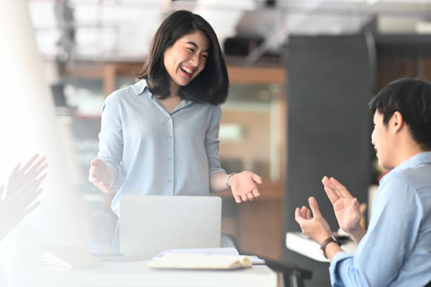 istock Business development team applauding to them boss while they finished discussing/meeting at the modern meeting table with comfortable meeting room as background. 1206150348