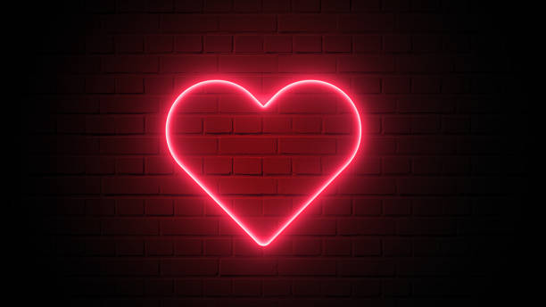 istock Red heart shape neon light on dark wall backgorund. Abstract and decoration concept. Happy Valentines day element. Sign and symbol electric light glow banner. 3D illustration render. 4K footage video 1206150743