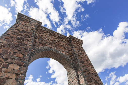 The Roosevelt Arch at the Entrance of Yellowstone National Park. The Roosevelt Arch inscribed with 