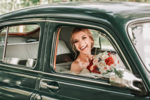 istock happy bride looking through the window of the ca 1206154335