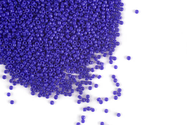 istock Scattering of colored beads on a white background 1206154979