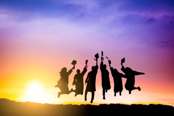 The Silhouette of  graduation group celebrating and jumping on mountain The Silhouette of  graduation group celebrating and jumping on mountain taiwan photos stock pictures, royalty-free photos & images