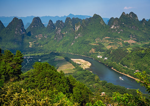 Xianggong Hill viewpoint panorama of beautiful green, lush and dense karst mountain landscape in Yangshuo, Guangxi Province, China