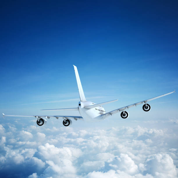 istock White passenger aircraft flying over clouds 1206162728
