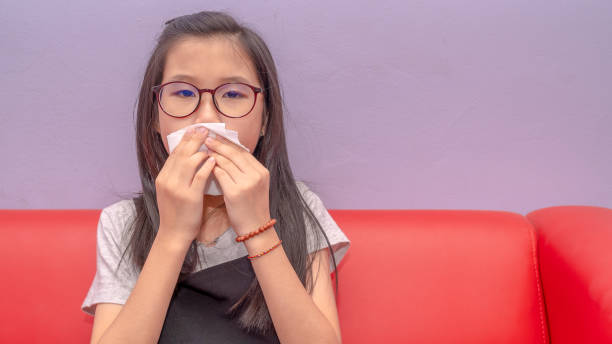 istock Asian girl cover her mouth 1206162765