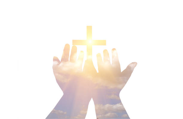 the cross on the hand and the light - belief in god imagens e fotografias de stock