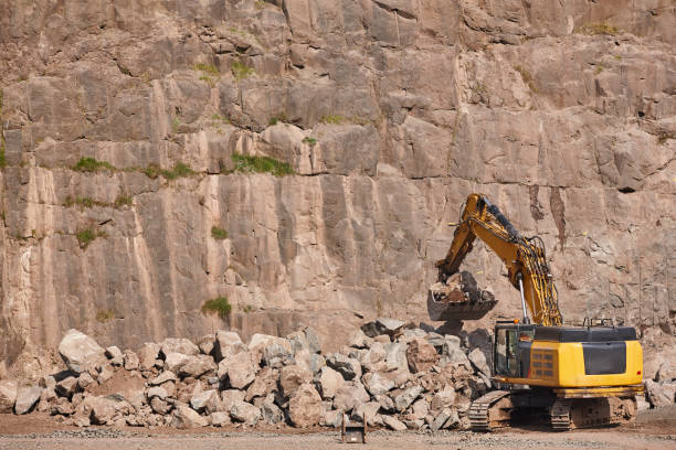 Excavator working on a stone quarry. Geological and mineral excavation
