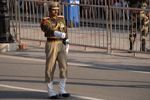 Attari, India - February 8, 2020: Indian Border Security Force members face off against Pakistan Rangers at the Wagah Border ceremony