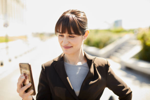 istock Business woman looking at phone screen. 1206170662