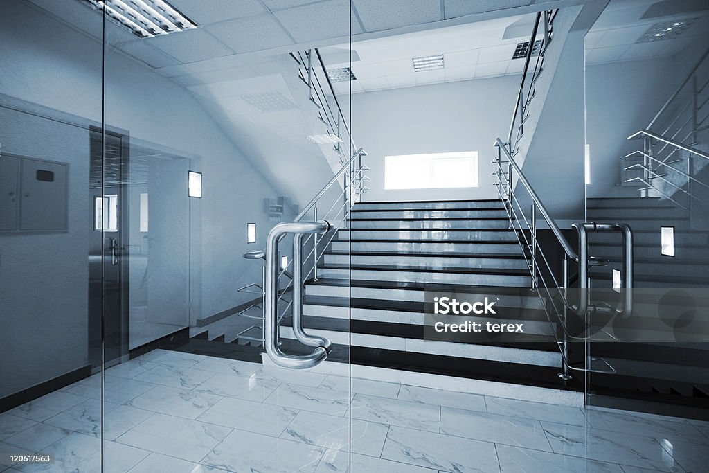 Glass doors Glass doors with a kind on a marble staircase Glass - Material Stock Photo