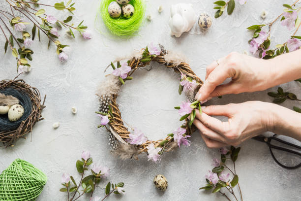 istock Spring wreath with flowers on light. Creative flat lay. Top view. Decor handmade. Woman decorated. 1206177061