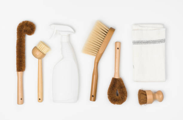 istock Natural cleaning products dish brush, detergent and cloth on white 1206177553