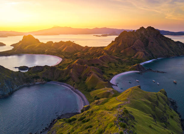 Aerial view of majestic Padar Island, with dramatic sunlight during sunset Aerial view of majestic Padar Island, with dramatic sunlight during sunset pulau komodo stock pictures, royalty-free photos & images