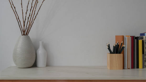 istock Close up view of modern workspace on marble desk with white wall 1206178727