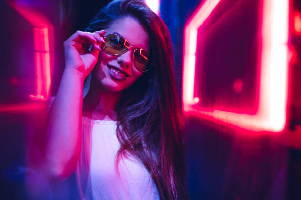 istock Woman and neon light 1206182702