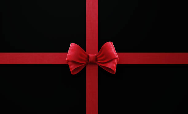 istock Red Ribbon Bow Tie on Black Background 1206184997